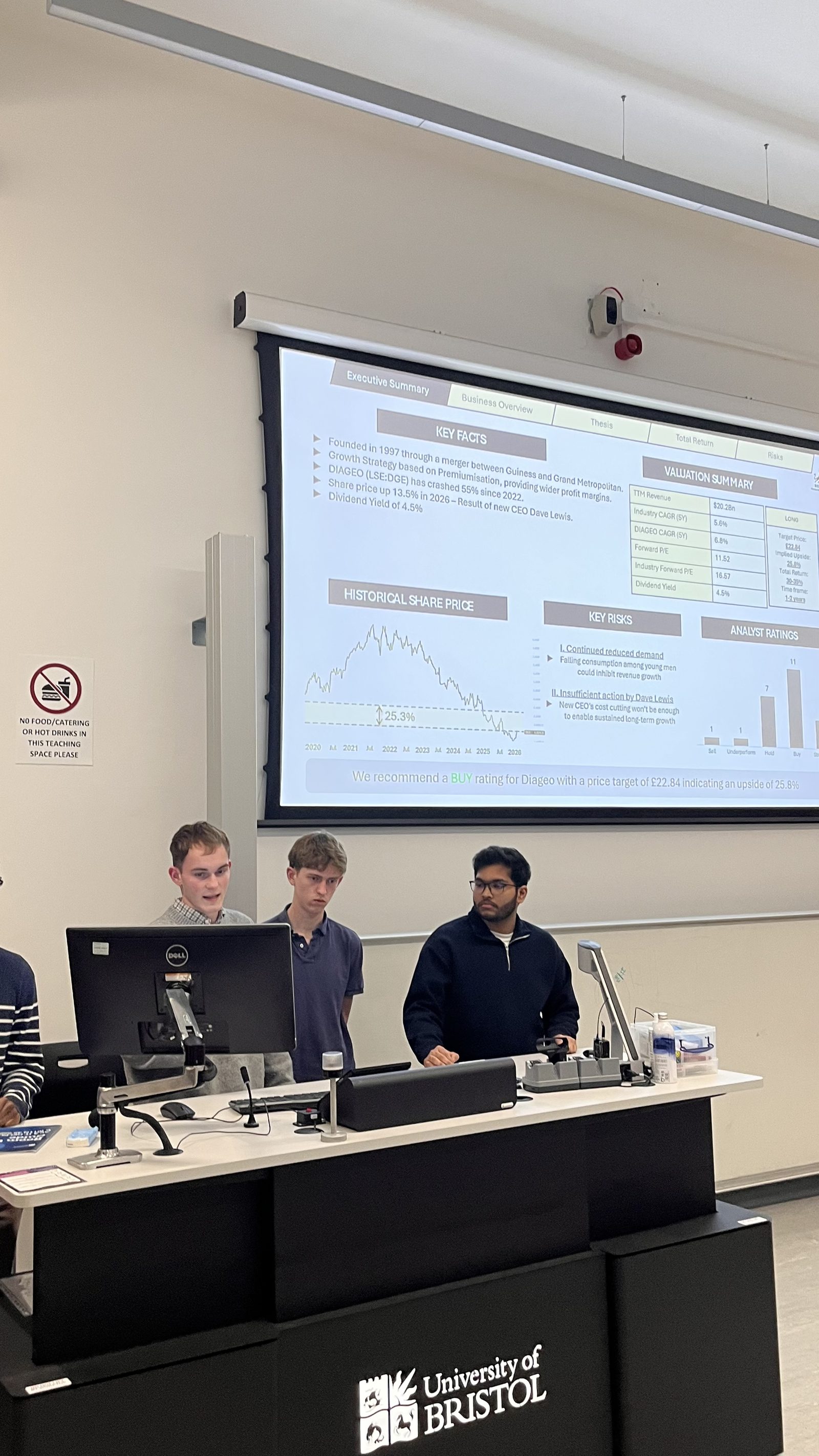 A team presenting their Diageo equity pitch to judges in a University of Bristol lecture theatre