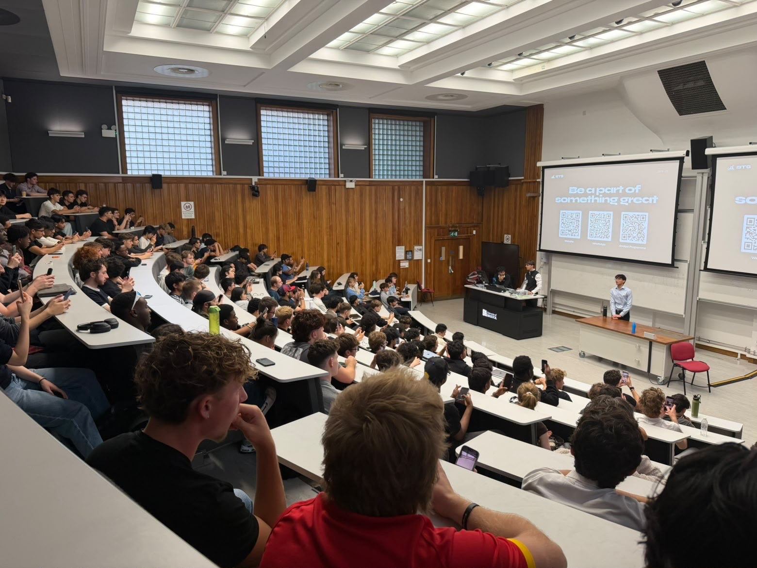Rows of students in Pugsley Lecture Theatre listening to the committee at the 2026 Welcome Event